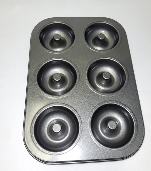 <span style='position: fixed;top: 500px;left: calc( 550px + (100vw - 600px)/2);'></span>
<table width='100%' border='0'>
  <tr>
    <td style='padding: 5px;width: 70%;background-color:#ec0d0d;vertical-align: middle;font-size:35px;height: 102px;border-radius: 20px;'>Doughnut Pan [6 Cup] Item no : N288-5</td>
    <td class='watch' align='center' style='position: fixed; background-image:url(assets/price.png);background-size: cover;
    font-size: 45px;
    top: 645px;
    left: calc( 460px + (100vw - 600px)/2);
    width: 245px;
    height: 200px;
    text-align: -webkit-center;
    vertical-align: middle;'><div style='padding-top: 90px;transform: rotate(7deg);'><span>50.00  R</span></div></td>    
  </tr>
</table>