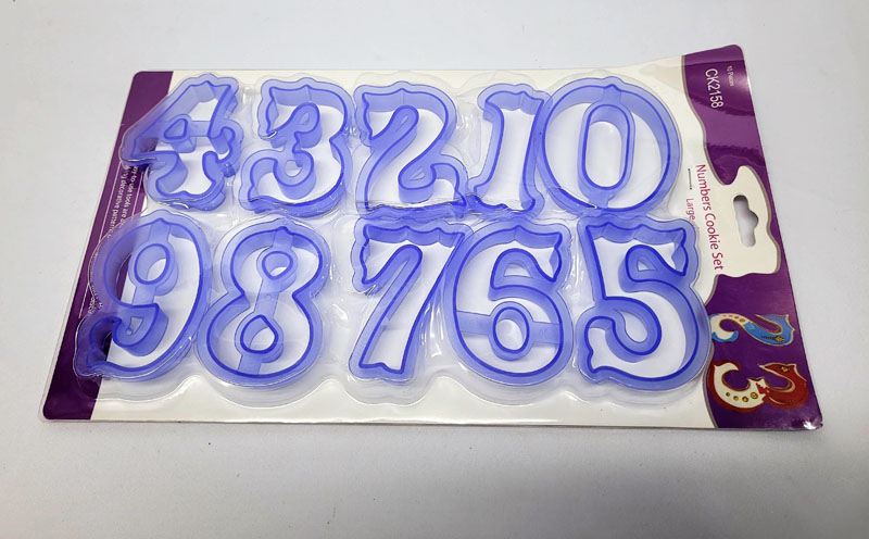 <span style='position: fixed;top: 500px;left: calc( 550px + (100vw - 600px)/2);'></span>
<table width='100%' border='0'>
  <tr>
    <td style='padding: 5px;width: 70%;background-color:#ec0d0d;vertical-align: middle;font-size:35px;height: 102px;border-radius: 20px;'>Numbers Cookie Set 10pc Item No:N873018</td>
    <td class='watch' align='center' style='position: fixed; background-image:url(assets/price.png);background-size: cover;
    font-size: 45px;
    top: 645px;
    left: calc( 460px + (100vw - 600px)/2);
    width: 245px;
    height: 200px;
    text-align: -webkit-center;
    vertical-align: middle;'><div style='padding-top: 90px;transform: rotate(7deg);'><span>70.00  R</span></div></td>    
  </tr>
</table>