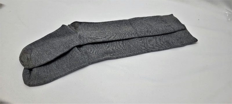 <span style='position: fixed;top: 500px;left: calc( 550px + (100vw - 600px)/2);'></span>
<table width='100%' border='0'>
  <tr>
    <td style='padding: 5px;width: 70%;background-color:#ec0d0d;vertical-align: middle;font-size:35px;height: 102px;border-radius: 20px;'>Knee High Grey Socks pack</td>
    <td class='watch' align='center' style='position: fixed; background-image:url(assets/price.png);background-size: cover;
    font-size: 45px;
    top: 645px;
    left: calc( 460px + (100vw - 600px)/2);
    width: 245px;
    height: 200px;
    text-align: -webkit-center;
    vertical-align: middle;'><div style='padding-top: 90px;transform: rotate(7deg);'><span>12.00  R</span></div></td>    
  </tr>
</table>